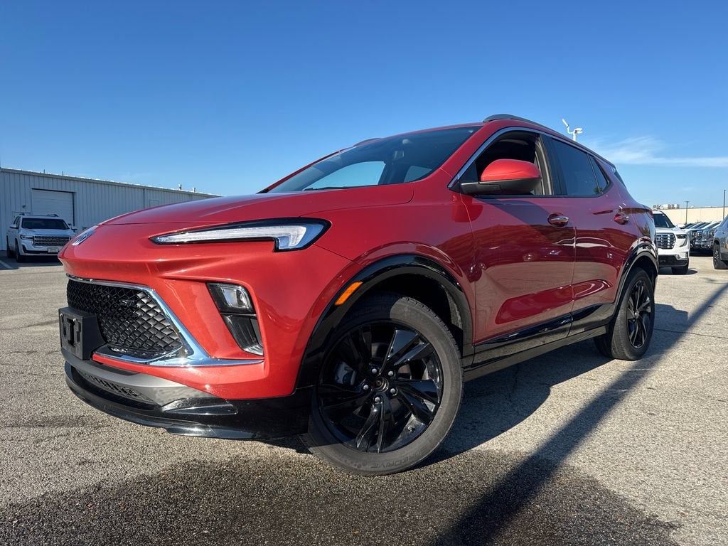 2024 Buick Encore GX Sport Touring in Sunrise Red Metallic — front three-quarter view