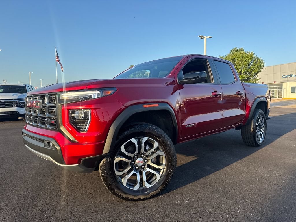 2024 GMC Canyon AT4 in Volcanic Red Tintcoat — front three-quarter view