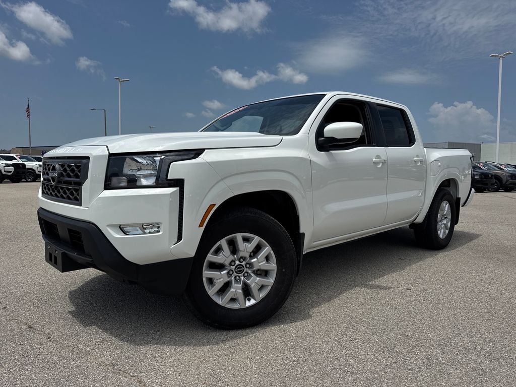 2024 Nissan Frontier SV in Glacier White — front three-quarter view