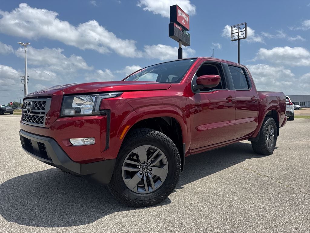 2023 Nissan Frontier SV in Cardinal Red Metallic — front three-quarter view