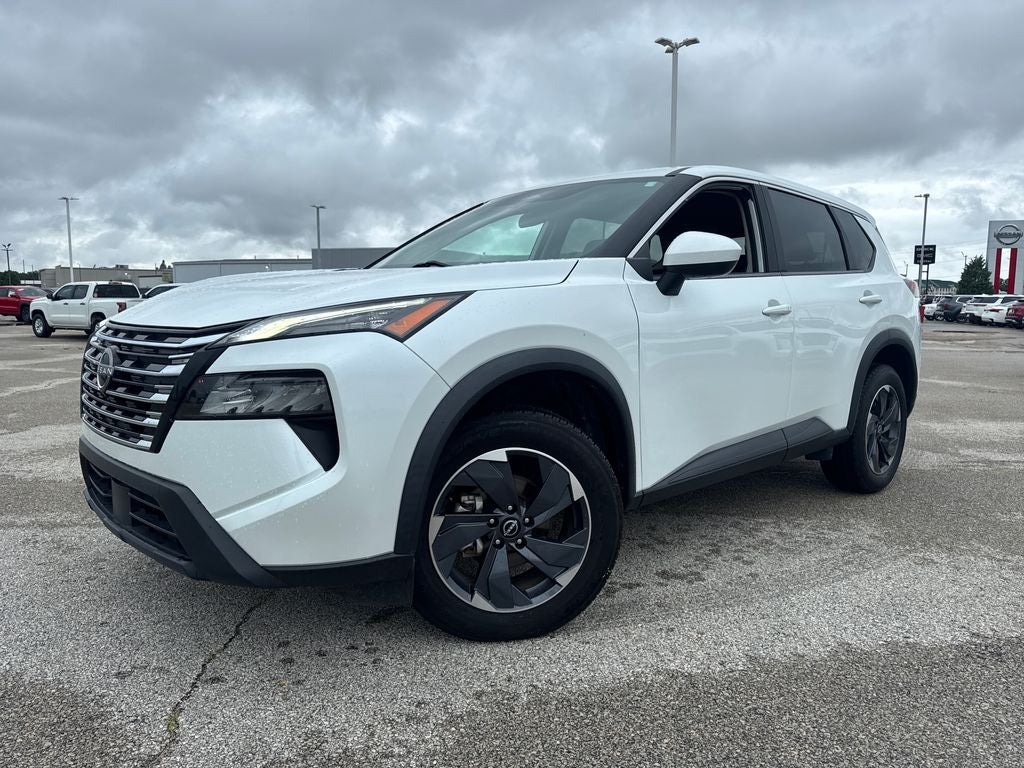 2024 Nissan Rogue SV in White Pearl — front three-quarter view