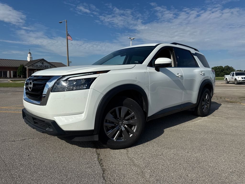 2024 Nissan Pathfinder SV in Glacier White — front three-quarter view