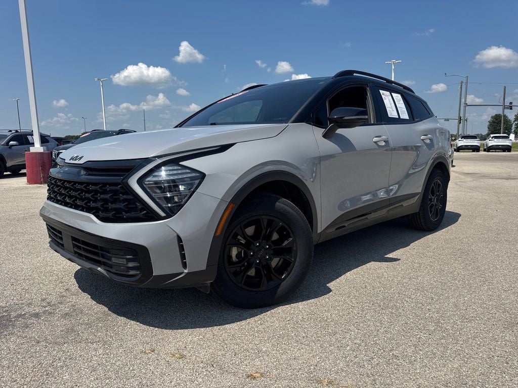 2025 Kia Sportage X-Pro in Ebony Black — front three-quarter view